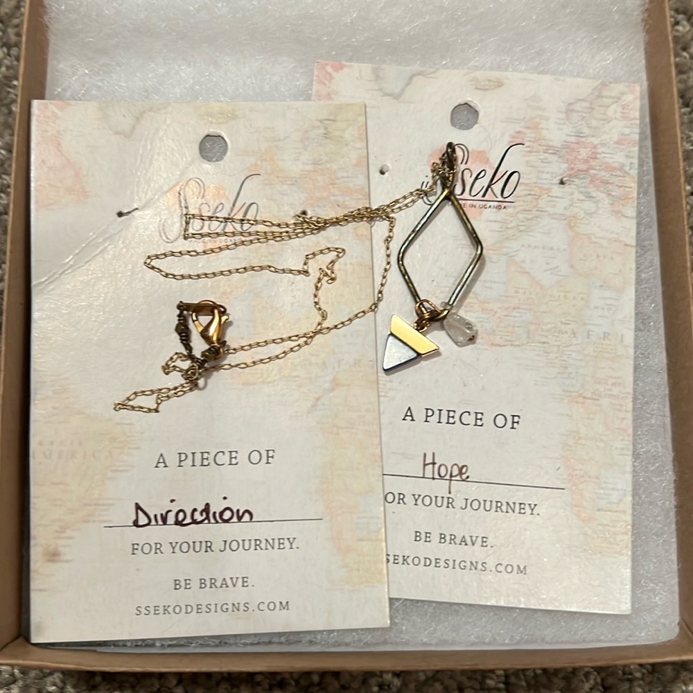Sseko charm necklace with two charm